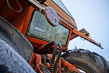 hydraulics of red and old tractor