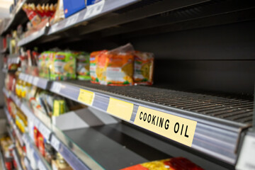 empty cooking oil shelf in supermarket display