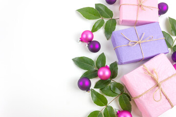 Christmas gift boxes with purple decorations on white background. Christmas concept. Flat lay. Copy space.