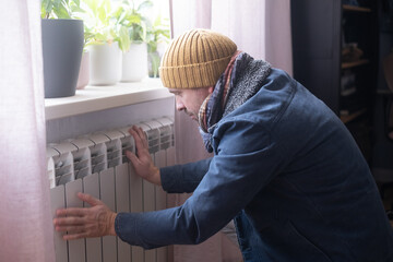 Man wearing warm clothing feeling cold . Energy crisis in Europe