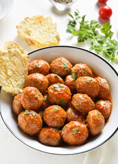 Meatballs with tomato sauce in bowl
