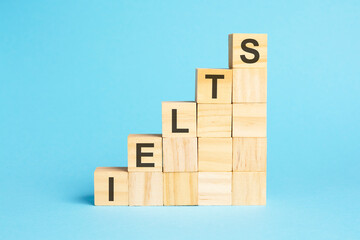 the word ielts is written on a wooden cubes, concept