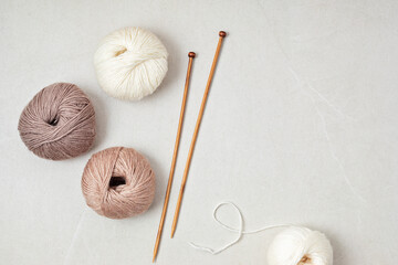 Craft hobby background with yarn in natural colors. Recomforting hobby to reduce stress for cold...