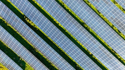 Aerial top view of solar panels or solar cells farm, renewable energy source. Ecotechnology for...