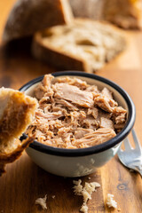 Canned tuna fish in the bowl.