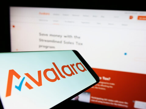 Stuttgart, Germany - 09-08-2022: Smartphone with logo of American software company Avalara Inc. on screen in front of business website. Focus on center-right of phone display.