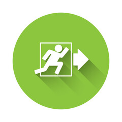 White Fire exit icon isolated with long shadow background. Fire emergency icon. Green circle button. Vector