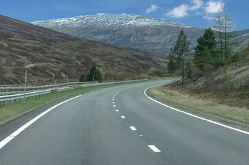 Empty winding road in the Scottish mountains