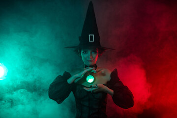 Photo of fear frightening lady warlock do dark magic cast spell use gemstone isolated mystic fog color background