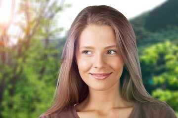 Fototapeta premium Female posing against nature and enjoying a summer day