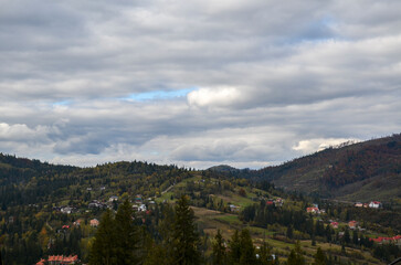 Fototapeta na wymiar Top view of Carpathian Mountains and village Slavske in autumn season in Ukraine
