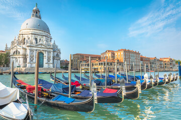 Fototapeta na wymiar Gondolas in Grand Canal and Santa Maria Della Salute, Venice, Italy