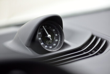 Dashboard stopwatch in sport car. Interior detail.