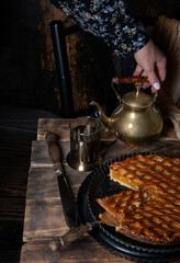 apricot pie with black tea on wooden table seasonal autumn still life