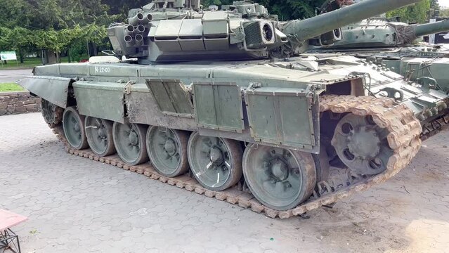The modern Russian T-90 tank was destroyed in the battles in Ukraine. A modern Russian tank with electron guided projectiles. Russian tanks on the streets of Ukrainian cities