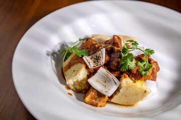 lomo saltado with corn and onion pie