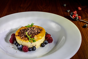 tres leches cake dessert with meringue and raspberries