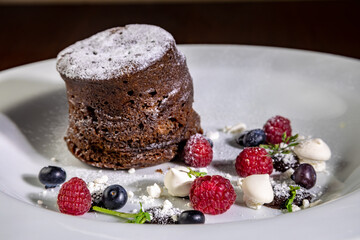 chocolate cake dessert with meringue and raspberries