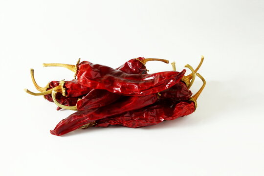 dry organic kashmiri red chili pepper well known for dark red color food recepi in indian gujarati food isolated on white background,selective focus
