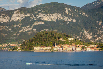 Mountain and Bellagio skyline view from Lake Como at sunset, northern Italy