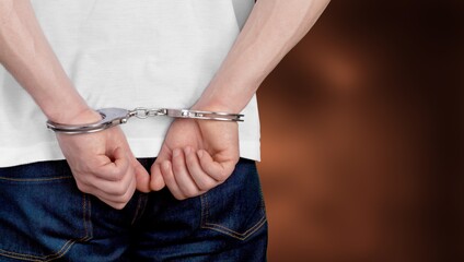 Humen's hands in handcuffs, criminal concept