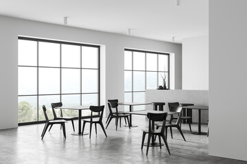 Fototapeta premium Corner view on modern bright cafe interior with four tables