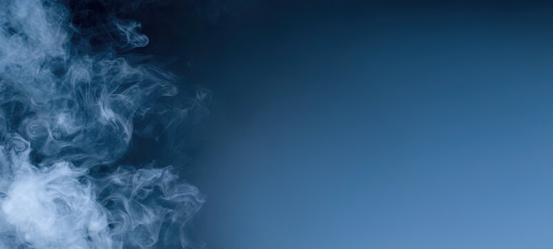 Cloud Of Blue Smoke. Abstract Smoke Wallpaper Background For Desktop Banner Design With Copyspace.