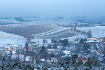 Turcianske Jaseno village and foggy winter rural landscape, Slovakia.