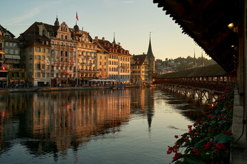 Cityscape with old bridge and buildings at sundown