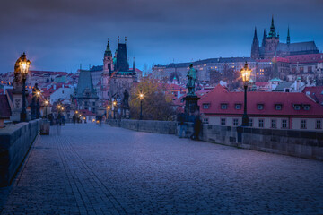 Naklejka na ściany i meble Charles bridge illuminated at dawn, Medieval Prague, Czech Republic