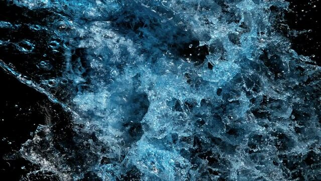 Super Slow Motion Shot of Water Splash on Black Background at 1000fps.