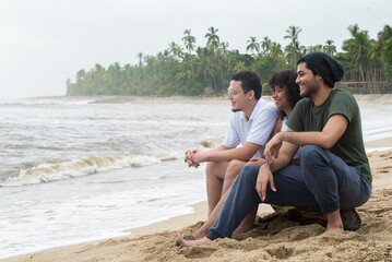 Group of friends having fun on the beach