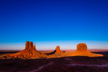 The Mittens, three buttes in Monument Valley at sunrise, Arizona and Utah, USA