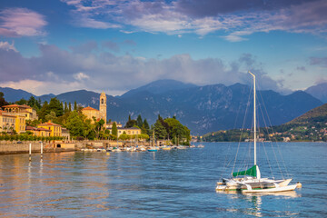 Fototapeta premium Lake Como coastline with Tremezzo village and sailboats at sunny day, Italy
