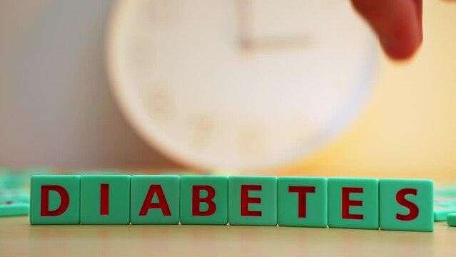 The word DIABETES made of small colorful cubes with letters. Chronic disease, insulin hormone issues. High quality 4k footage