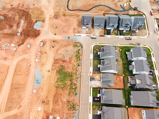 New houses on the construction site and a prepared place for construction. drone view.