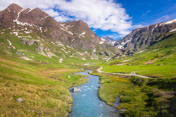 Fototapeta na wymiar River in idyllic and dramatic landscape of Haute Savoie in Vanoise, France