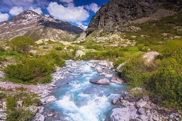 River in idyllic and dramatic landscape of Haute Savoie near Iseran Pass, France