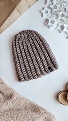 Fashionable knitted hats autumn-winter. The hat lies on a white background. Product layout. Buy a hat. Knitting. Hobby.