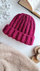Fashionable knitted hats autumn-winter. The hat lies on a white background. Product layout. Buy a hat. Knitting. Hobby.