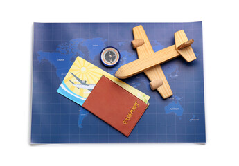 World map, wooden airplane, passport and compass isolated on white background