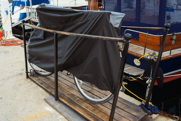 bicycle in a case in a closed sea club istanbul. bike next to the yacht