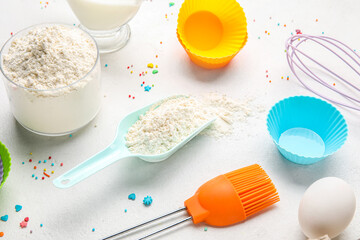 Composition with ingredients for baking pastry and utensils on light background