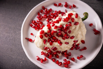 Chile en Nogada, Typical dish from Mexico. Prepared with poblano chili stuffed with meat and fruits and covered with a special walnut sauce. Named as the quintessential Mexican dish.