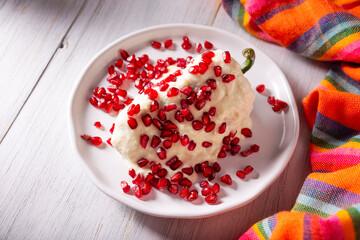 Chile en Nogada, Typical dish from Mexico. Prepared with poblano chili stuffed with meat and fruits and covered with a special walnut sauce. Named as the quintessential Mexican dish. s