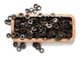 Wooden board of cut black olives on white background