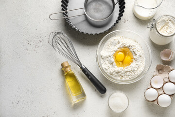 Different ingredients for baking on light background