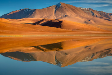 Fototapeta na wymiar Idyllic Lake Lejia reflection and volcanic landscape in Atacama desert, Chile