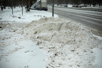 Snow on side of road. Snow removed from track.