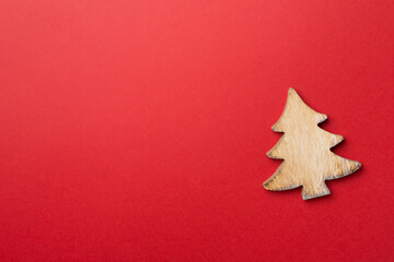 Fototapeta na wymiar Wooden Christmas tree on color background, top view
